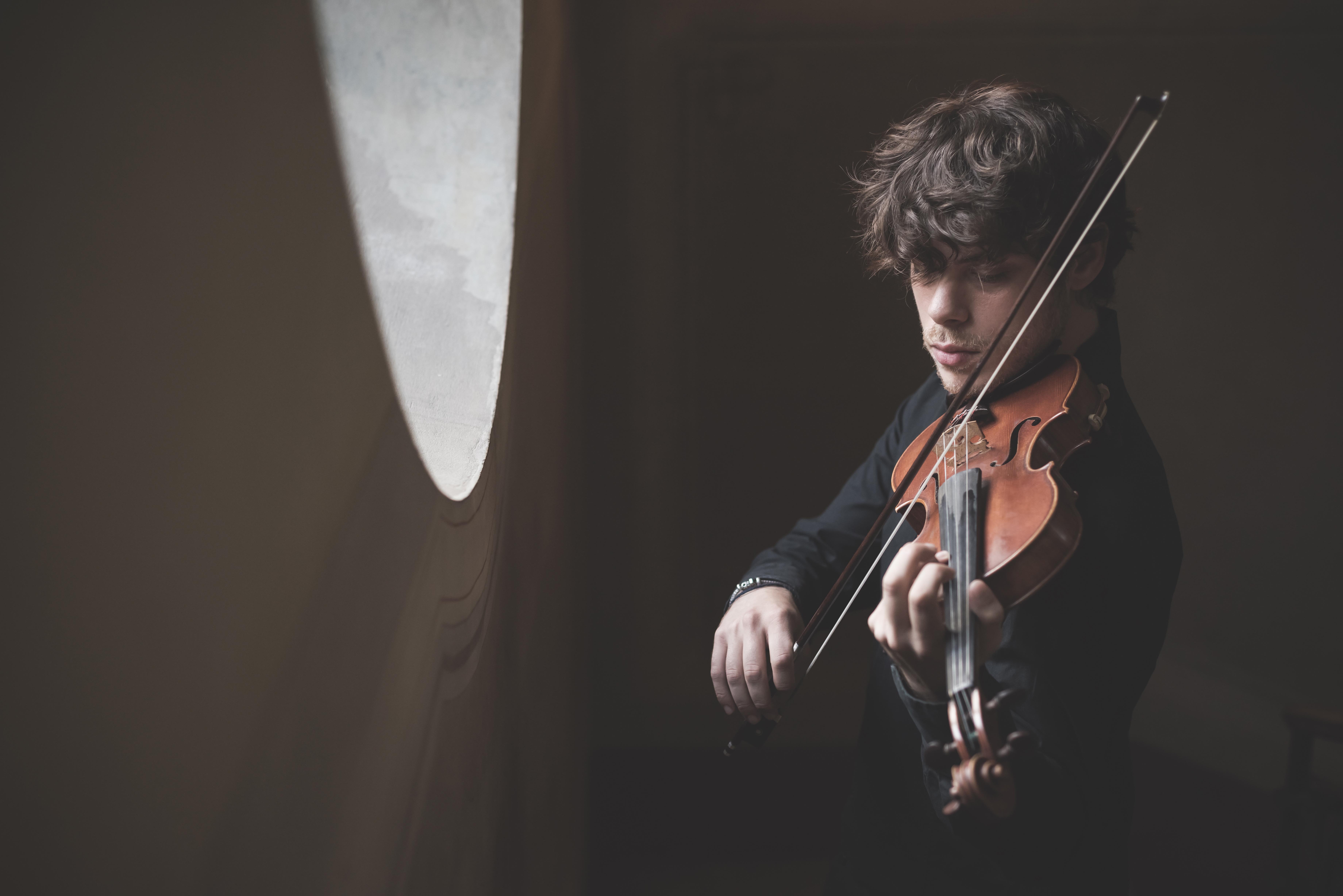 young handsome blonde violinist